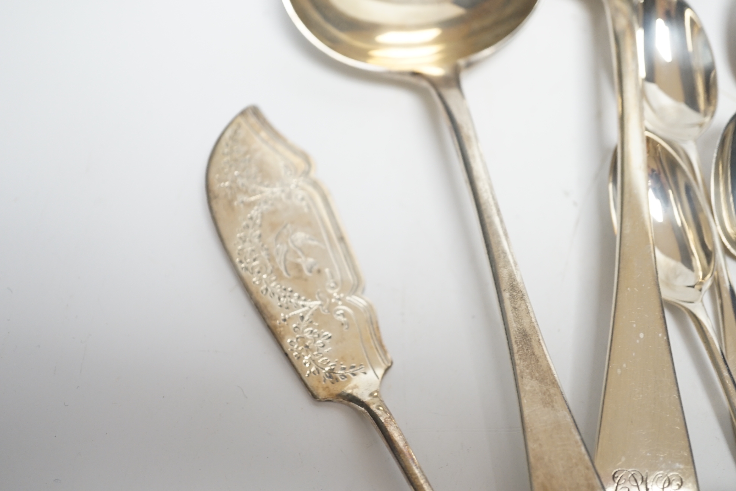 Assorted silver flatware, including teaspoons, various dates and makers, a pair of late Victorian silver Old English pattern sauce ladles, London, 1895 and a George III silver Old English pattern stilton scoop